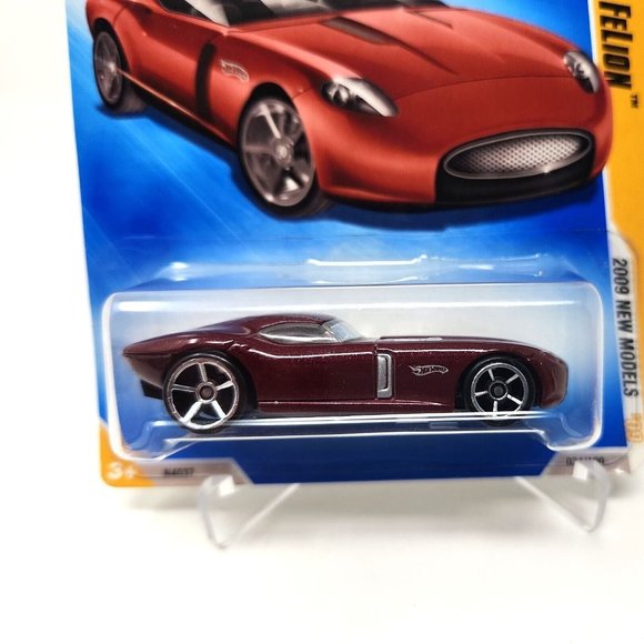 2009 Hot Wheels #34 New Models 34/42 FAST FELION 1:64 Burgundy (dd) - Picture 2 of 7